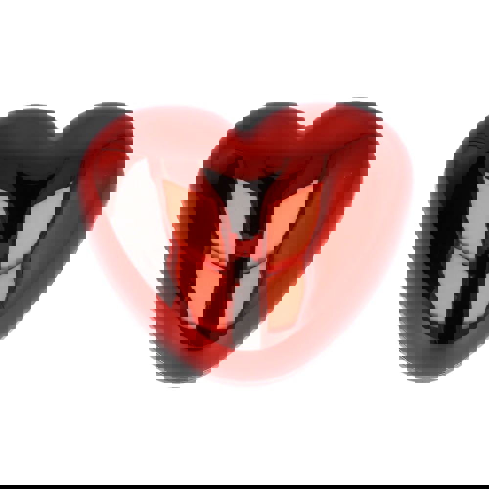 Lippenbalsam in metallischer Herzformdose